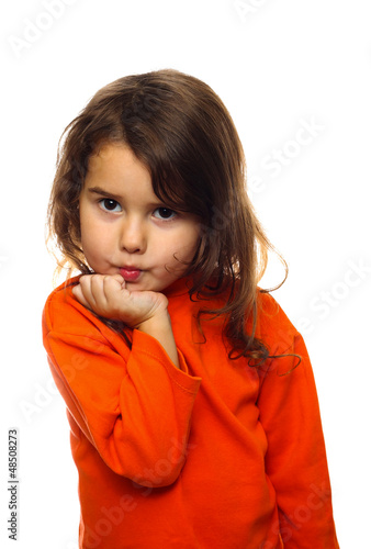 Photo: portrait of curly brunette girl child orange sweater flirt flirt portrait of curly brunette girl child orange sweater flirt flirt