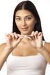 Photo: Closeup of a young woman breaking a cigarette Closeup of a young woman breaking a cigarette