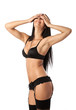 Photo: Happy young woman in lingerie closing eyes with hands Happy young woman in lingerie closing eyes with hands