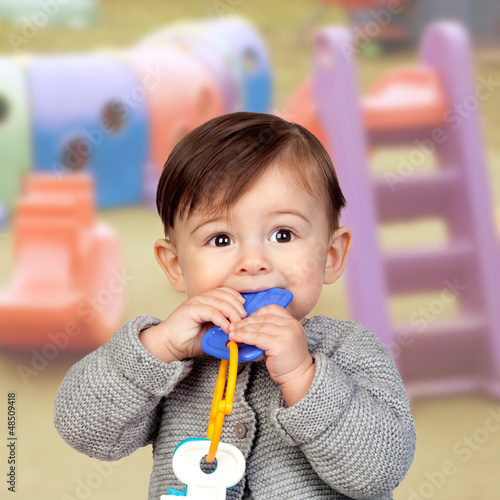 Photo: Adorable baby girl in the creche Adorable baby girl in the creche