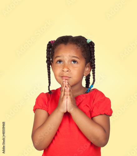 Photo: Sad little girl praying for something Sad little girl praying for something