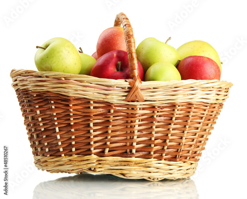 Photo: juicy apples in basket, isolated on white juicy apples in basket, isolated on white
