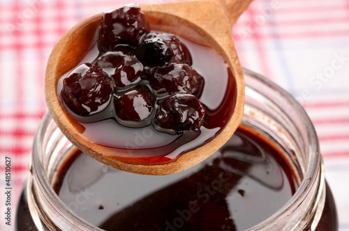 Photo: tasty berry jam, close up tasty berry jam, close up