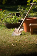 Garden shovel with pots and plants.