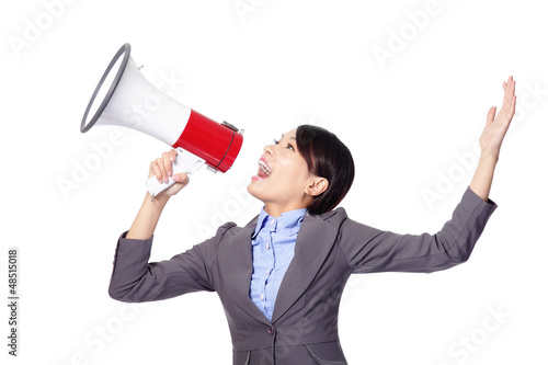 Photo: Business woman screaming in megaphone Business woman screaming in megaphone