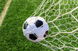 soccer ball in goal net