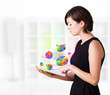 Young woman looking at modern tablet with pie charts