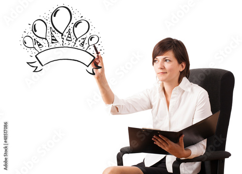Photo: Young girl drawing a party label on whiteboard Young girl drawing a party label on whiteboard