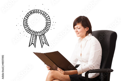Photo: Young business woman presenting a ribbon Young business woman presenting a ribbon
