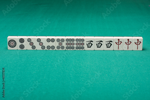 Photo: Smooth table surface with a mahjong on it Smooth table surface with a mahjong on it