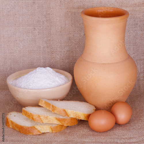 Photo: Flour, bread and a pitcher Flour, bread and a pitcher