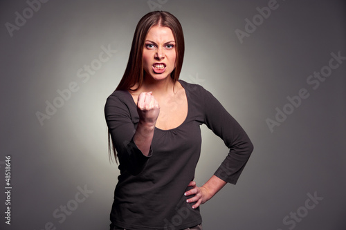 Photo: angry woman threatening the fist angry woman threatening the fist