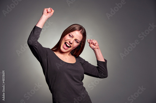 Photo: happy excited woman dancing happy excited woman dancing