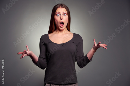 Photo: worried woman over dark background worried woman over dark background