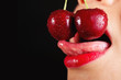 Photo: Detail of young woman mouth with cherries Detail of young woman mouth with cherries