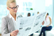 Woman with newspaper