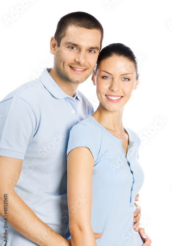 Photo: Happy smiling young couple, on white Happy smiling young couple, on white