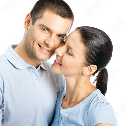 Photo: Happy smiling young couple, on white Happy smiling young couple, on white