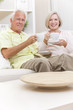 Senior Man & Woman Drinking Tea Coffee at Home