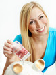 Woman is happy to save money in her piggy bank
