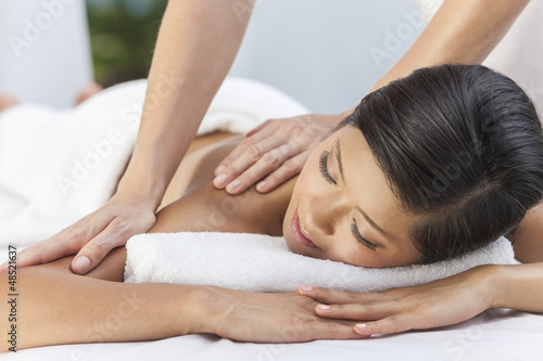 Photo: Woman Relaxing At Health Spa Having Massage Woman Relaxing At Health Spa Having Massage