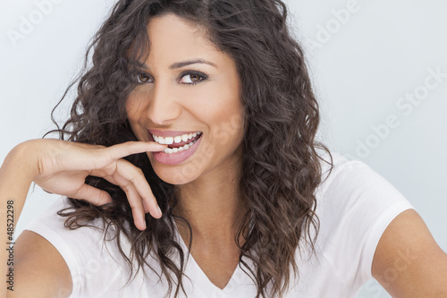 Photo: Beautiful Happy Woman Smiling Biting Finger Beautiful Happy Woman Smiling Biting Finger