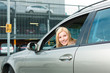 Woman back her car on a parking level