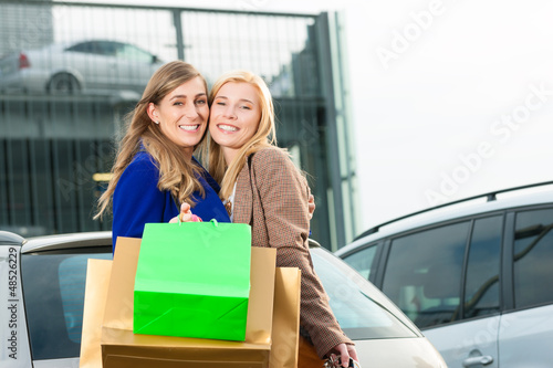 Photo: Two women were shopping and driving home Two women were shopping and driving home