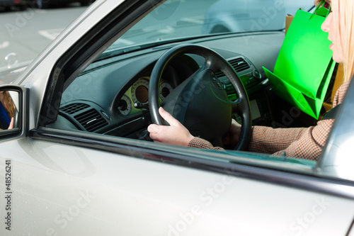 Photo: Women was shopping and driving home Women was shopping and driving home