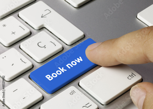 Photo: Book now keyboard key. Finger Book now keyboard key. Finger