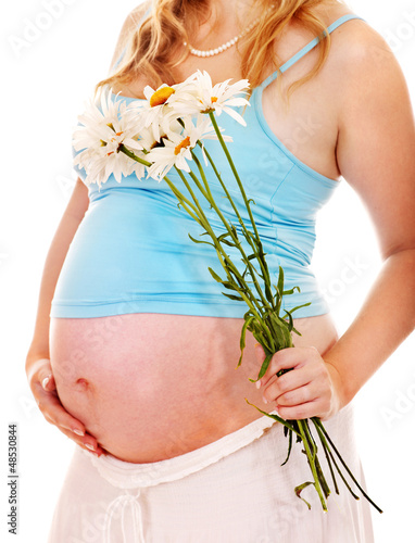 Photo: Pregnant woman with flower. Pregnant woman with flower.