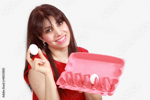 Photo: Smiling lady with egg and egg tray Smiling lady with egg and egg tray