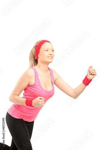 Photo: A young female runner running A young female runner running