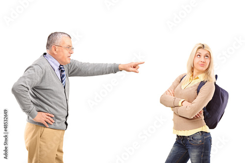 Photo: Angry father reprimanding his daughter Angry father reprimanding his daughter