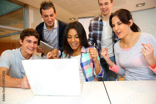 Photo: Group of students in computer training with teacher Group of students in computer training with teacher