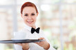 attractive young waitress serving coffee in cafe