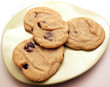 Homemade chocolate chip cookies on small green plate
