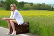 Photo: Beautiful girl on old suitcase Beautiful girl on old suitcase