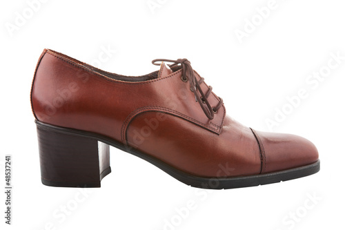 Photo: Vintage female shoe isolated on white Vintage female shoe isolated on white