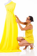 female dressmaker working on a dress