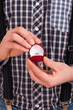 Photo: Man holding box with wedding ring Man holding box with wedding ring
