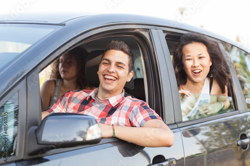Photo: Boys and Girls in a Car Leaving for Vacation Boys and Girls in a Car Leaving for Vacation
