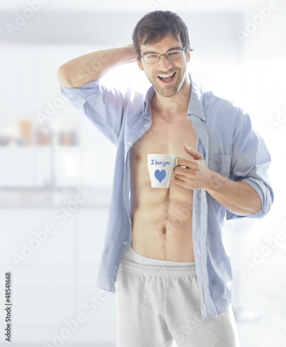 Photo: Smiling man with cup Smiling man with cup
