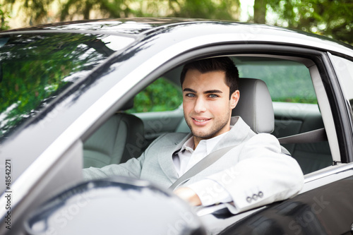 Photo: Man driving a car Man driving a car