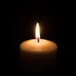 Candle on black background