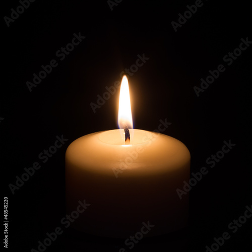 Photo: Candle on black background Candle on black background