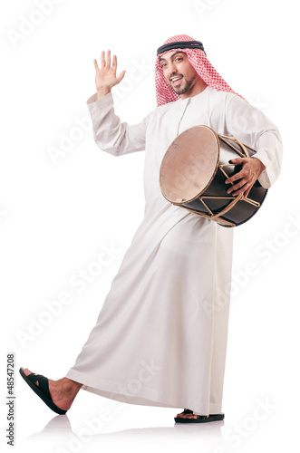 Photo: Arab man playing drum isolated on white Arab man playing drum isolated on white