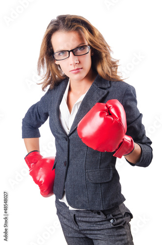 Photo: Woman businesswoman with boxing gloves on white Woman businesswoman with boxing gloves on white