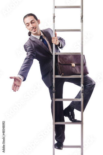 Photo: Businessman climbing the ladder isolated on white Businessman climbing the ladder isolated on white