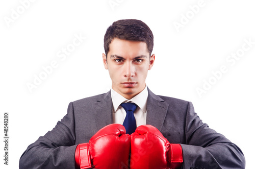 Photo: Businessman with boxing gloves on white Businessman with boxing gloves on white